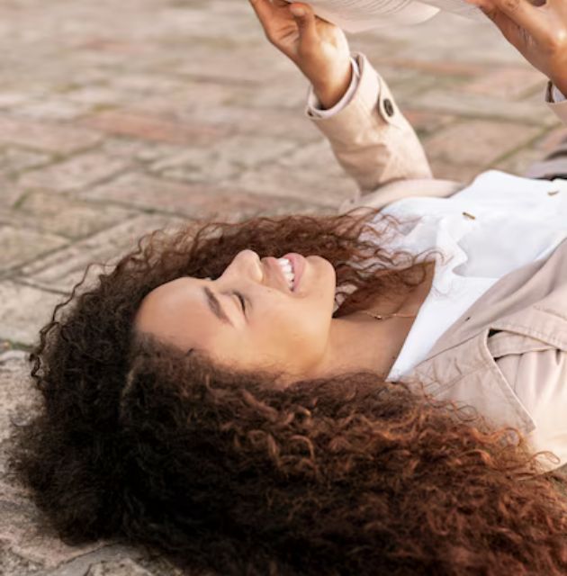  "Close-up of natural curly hair, emphasizing the texture and intricate patterns of the curls."