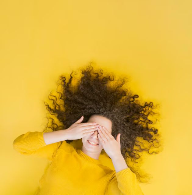 "Curly hair in a protective twist style, highlighting a popular method for managing and maintaining curl health."