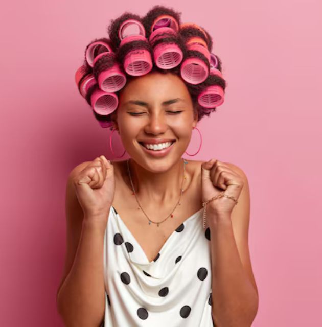 "Side view of a scrunchie being used to secure a bun, showing the gentle and elastic nature of the accessory for curly hair."